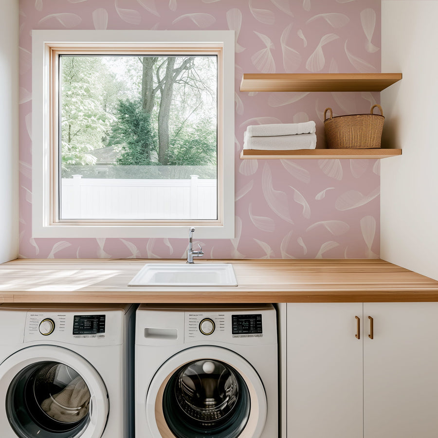 Laundry room with washing machines, wooden countertop, and Pink Quill Whispers - Modern Feather Wallpaper