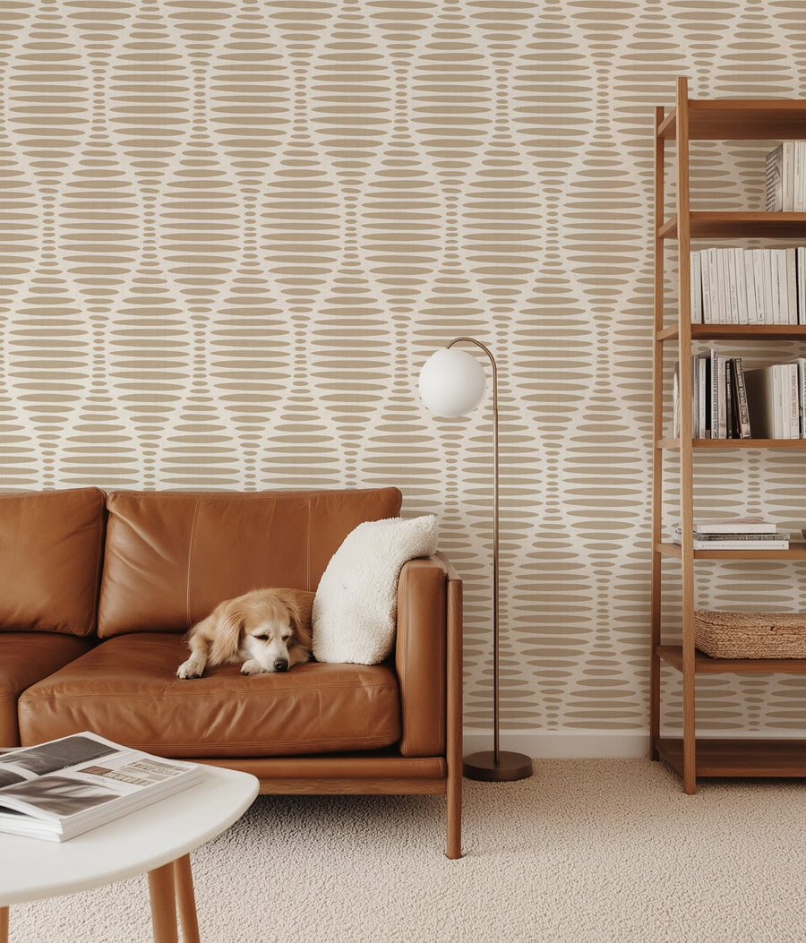 Living room with Ogee Sketchy Ovals Wallpaper - Brown & Cream, bed, and window with plant