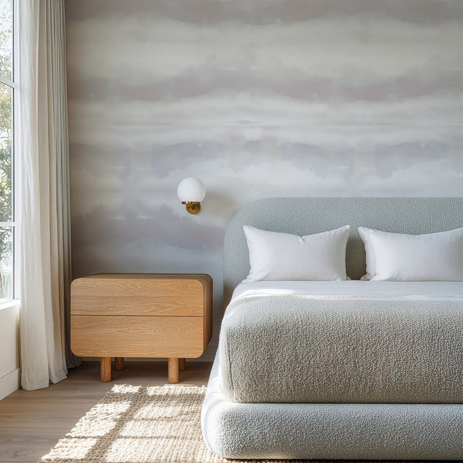 Modern bedroom with a bed, nightstand, and Grey Blush Watercolor Stripe Wallpaper