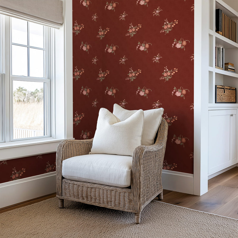 Wicker chair with white cushions in a room with Burgundy Heritage Heirloom Floral Wallpaper