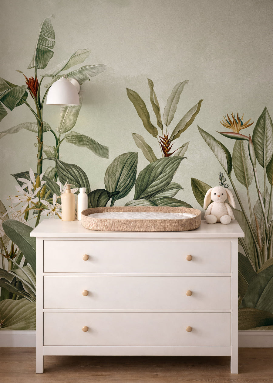 White dresser with a changing pad against a wall with Eden Tropical Palm Wall Mural