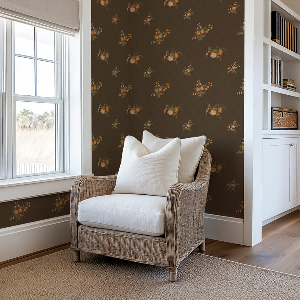 Wicker chair with white cushions in a room with Vintage Heirloom Floral Bouquet Wallpaper - Chocolate Brown Background