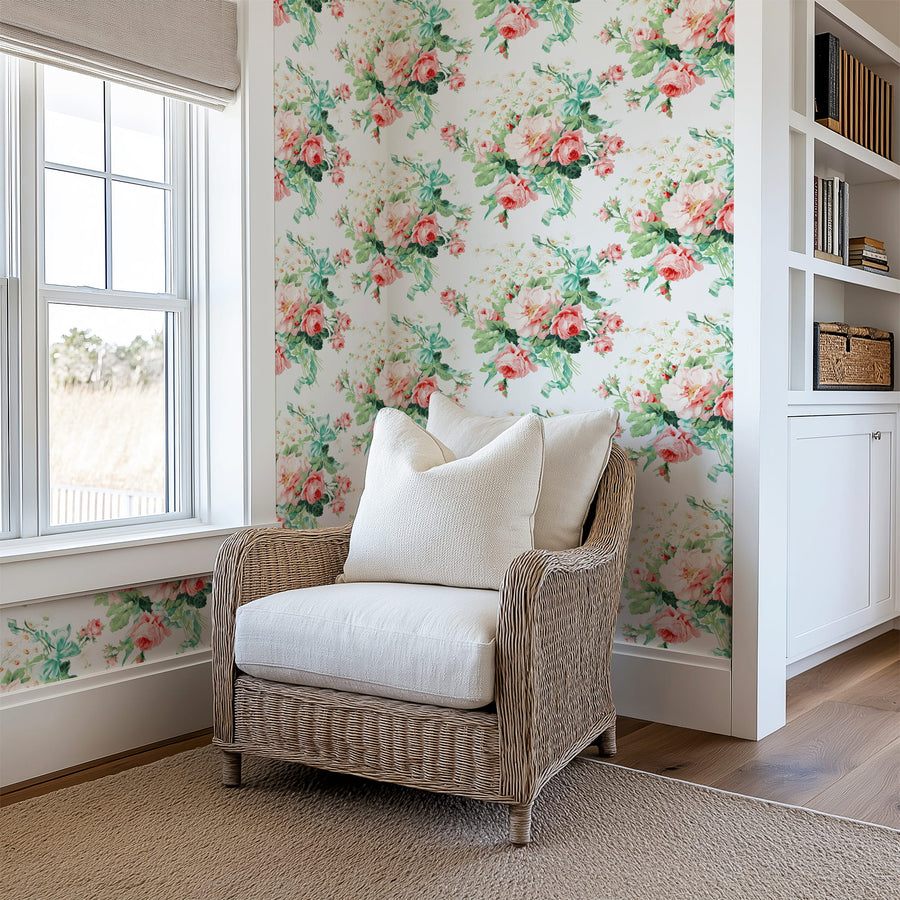 Wicker chair with white cushions in a room with Vintage Rose Bouquet Wallpaper