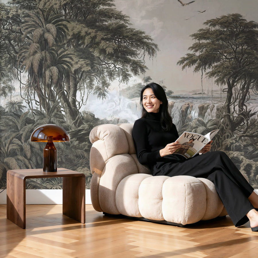 Woman reading a magazine in a stylish room with a Grand Tropical Grisaille Waterfall Scenic Wall Mural