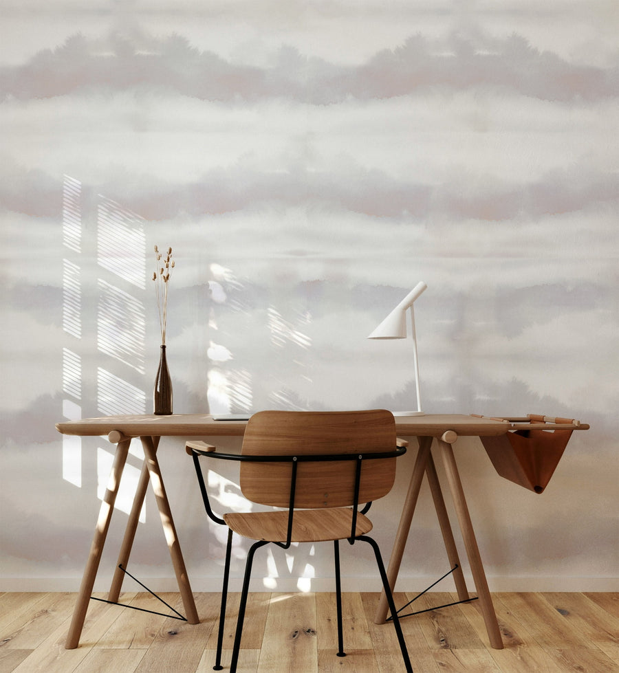 Wooden desk and chair in a room with a Grey Blush Watercolor Stripe Wallpaper