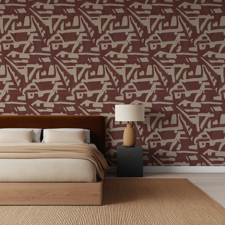 Bedroom with rust velvet headboard and black nightstand featuring Abstract Brushstroke Wallpaper Burgundy Taupe accent wall