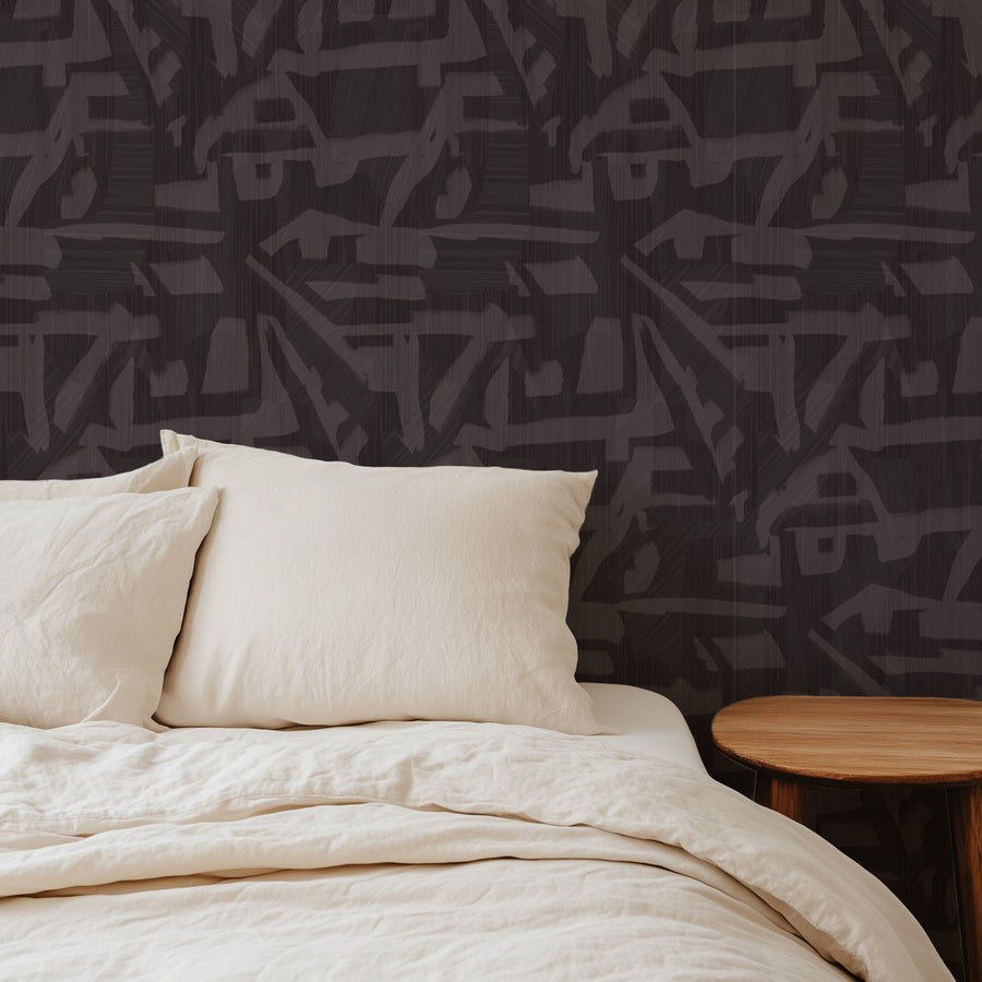 Bedroom with cream bedding featuring Abstract Brushstroke Wallpaper Charcoal Grey by Petra Kohlmayr