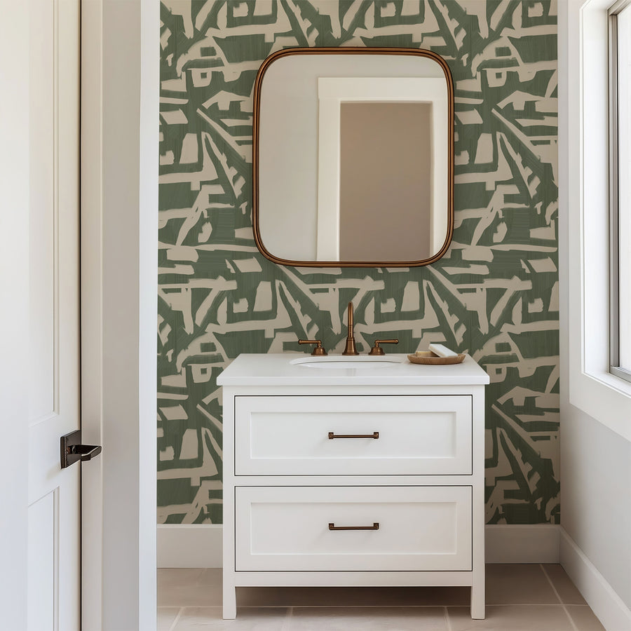 Bathroom with white vanity and arched-top framed mirror featuring Abstract Brushstroke Wallpaper Sage Green Cream by Petra Kohlmayr