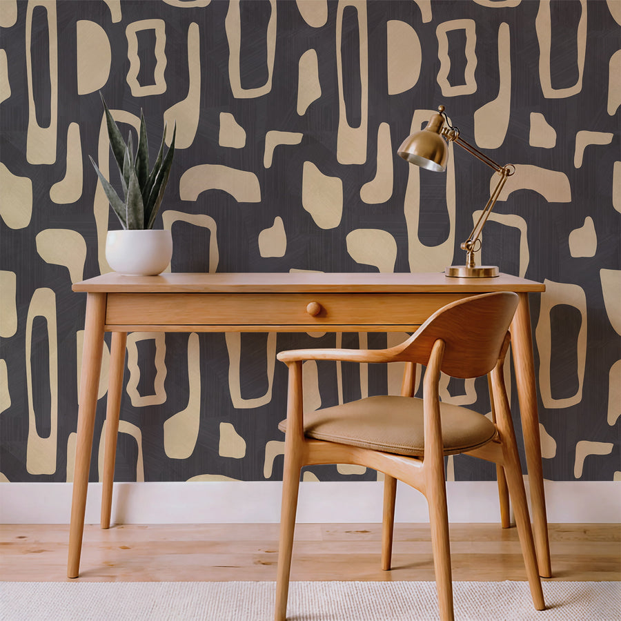 Dining nook with wood table and potted plant featuring Abstract Organic Shapes Wallpaper Cream Charcoal accent wall