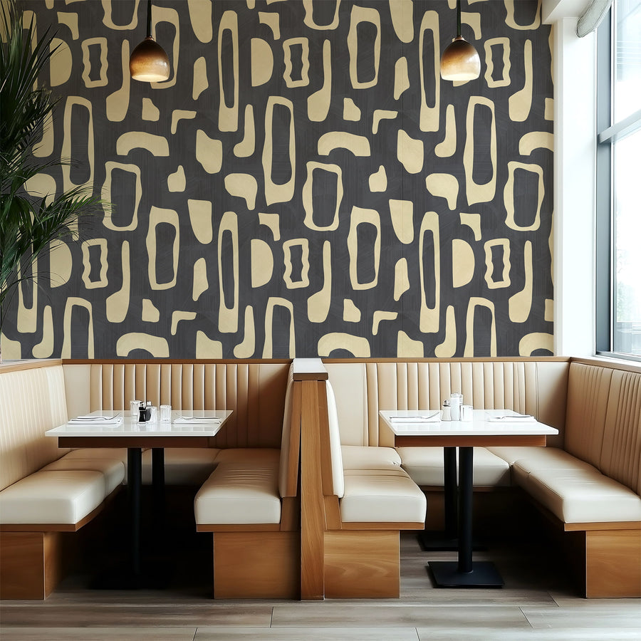 Restaurant booth with banquette seating featuring Abstract Organic Shapes Wallpaper Cream Charcoal accent wall