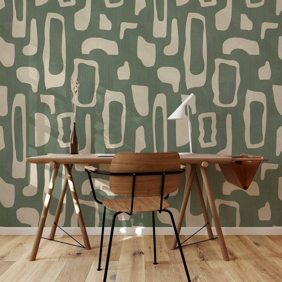 Dining nook with wood table and chairs featuring Abstract Organic Shapes Wallpaper Sage Green Beige accent wall