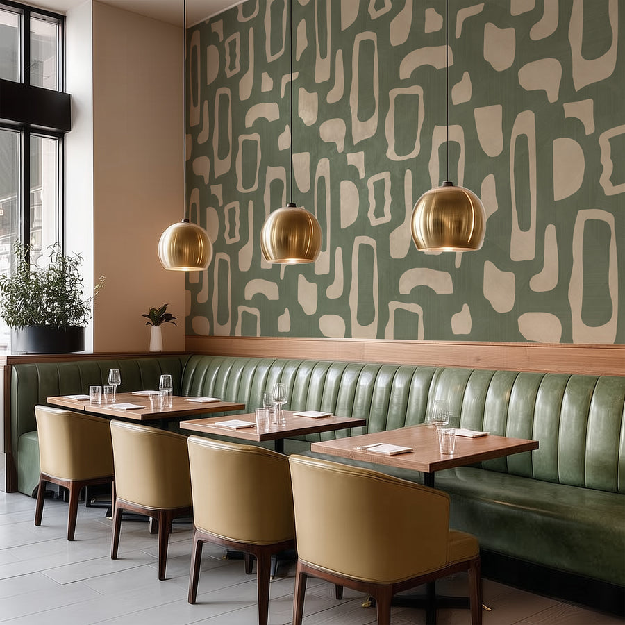 Restaurant with banquette seating and pendant lights featuring Abstract Organic Shapes Wallpaper Sage Green Beige accent wall