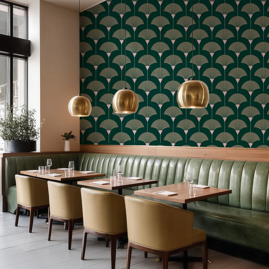Forest and sage green Art Deco fan wallpaper in a dining room above green banquette seating