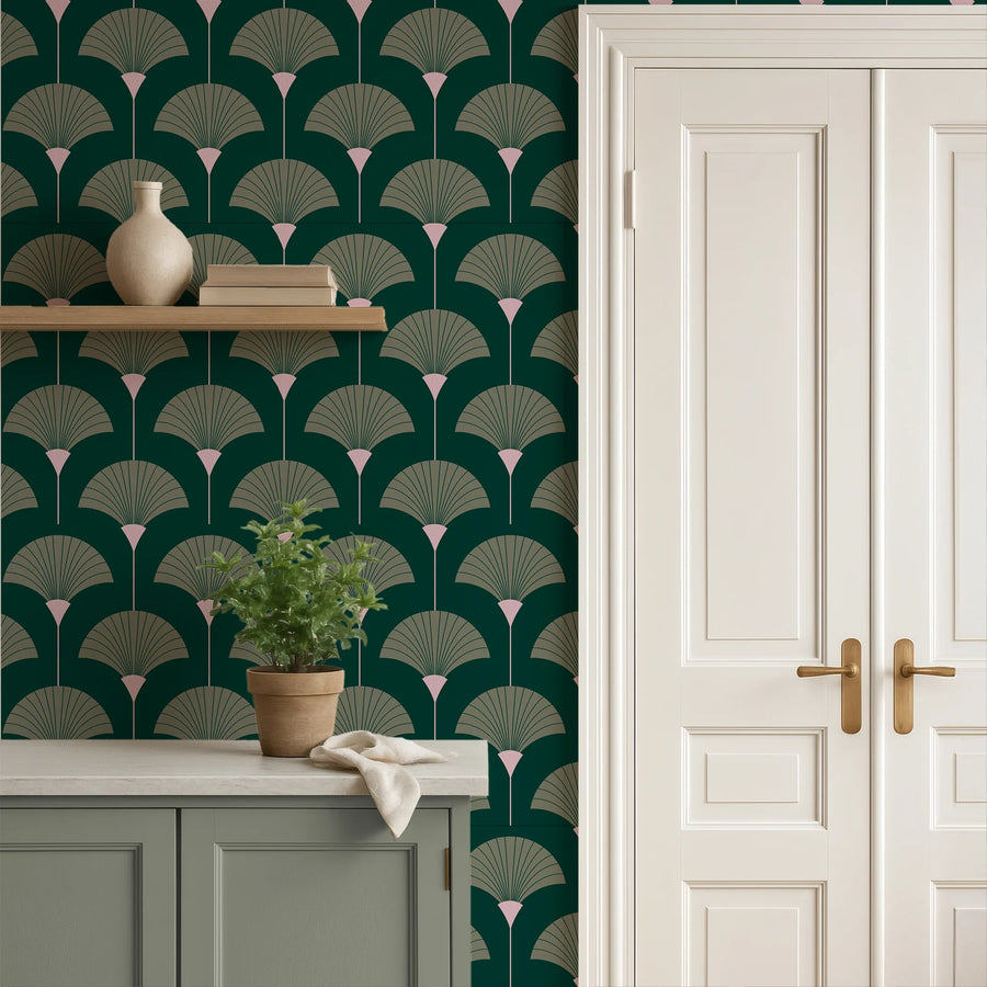 Forest and sage green Art Deco fan wallpaper in a hallway beside a paneled door and shelf