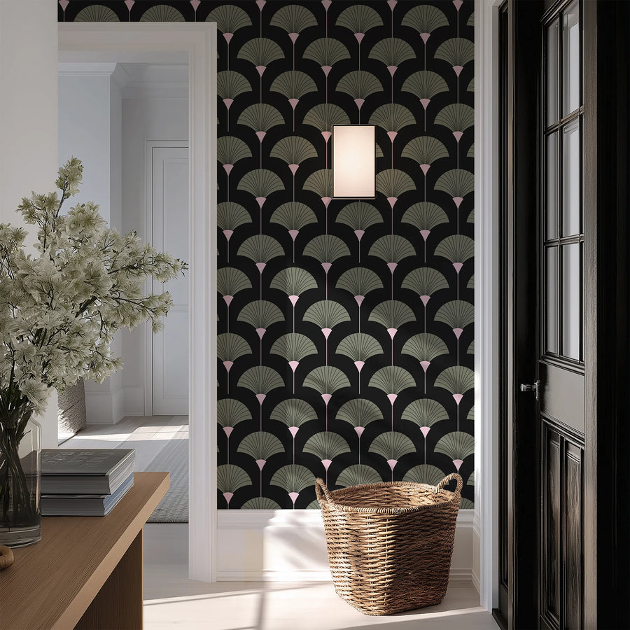 Sage green and black Art Deco fan wallpaper in an entryway with a woven basket and console