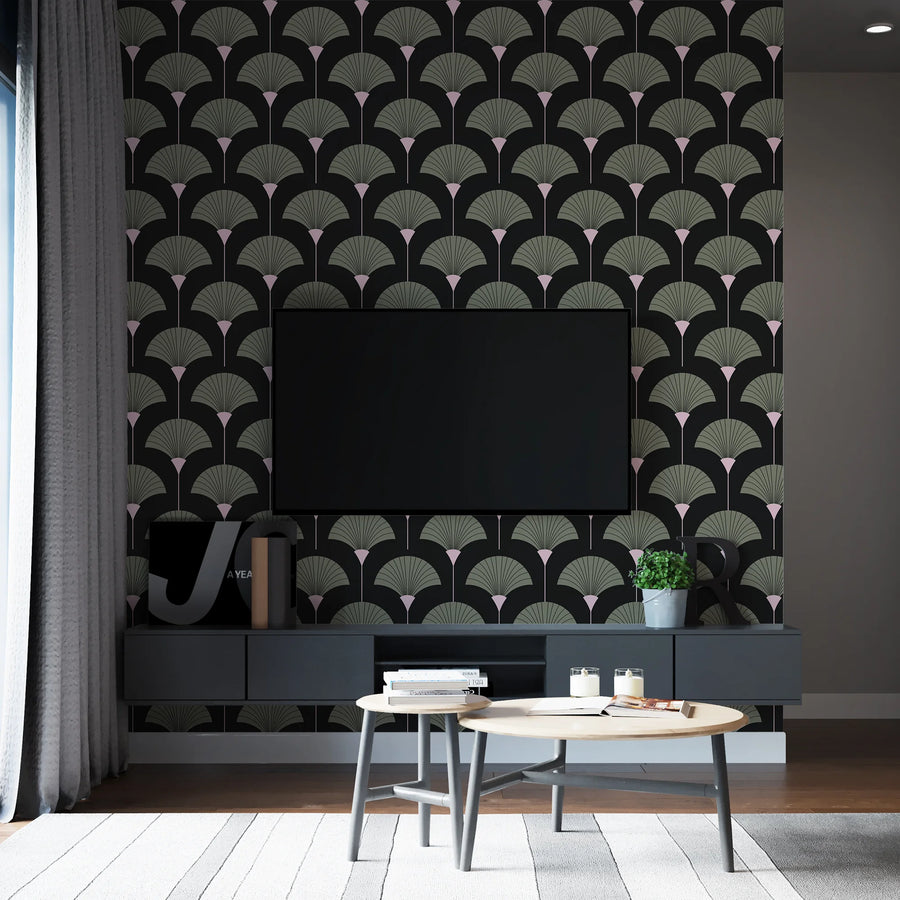 Sage green and black Art Deco fan wallpaper on a media wall behind a wall-mounted television