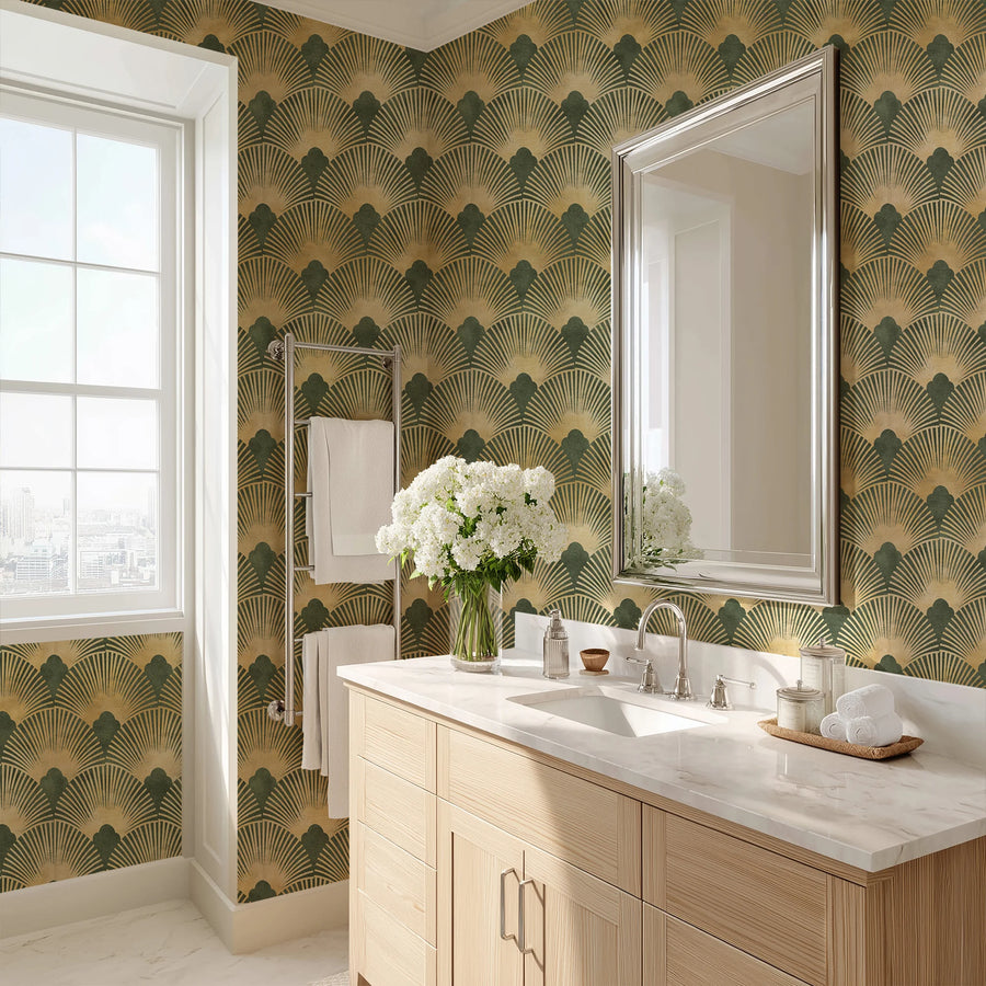 Green and gold Art Deco scallop wallpaper in a bathroom above a wood vanity with a framed mirror