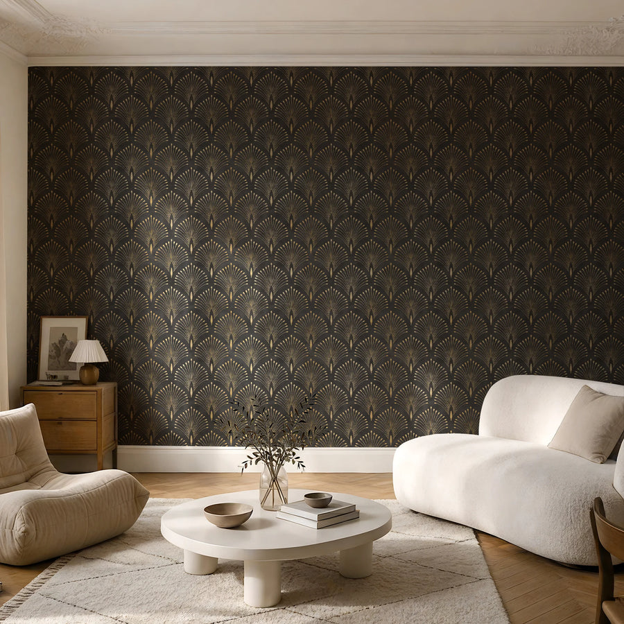Art deco black and gold fan wallpaper in a living room with a cream sofa