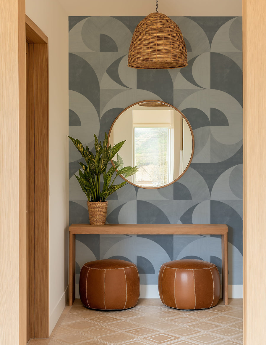 Foyer with arched mirror vanity and terracotta stools featuring Bauhaus Geometric Circles Wallpaper Dusty Blue Grey