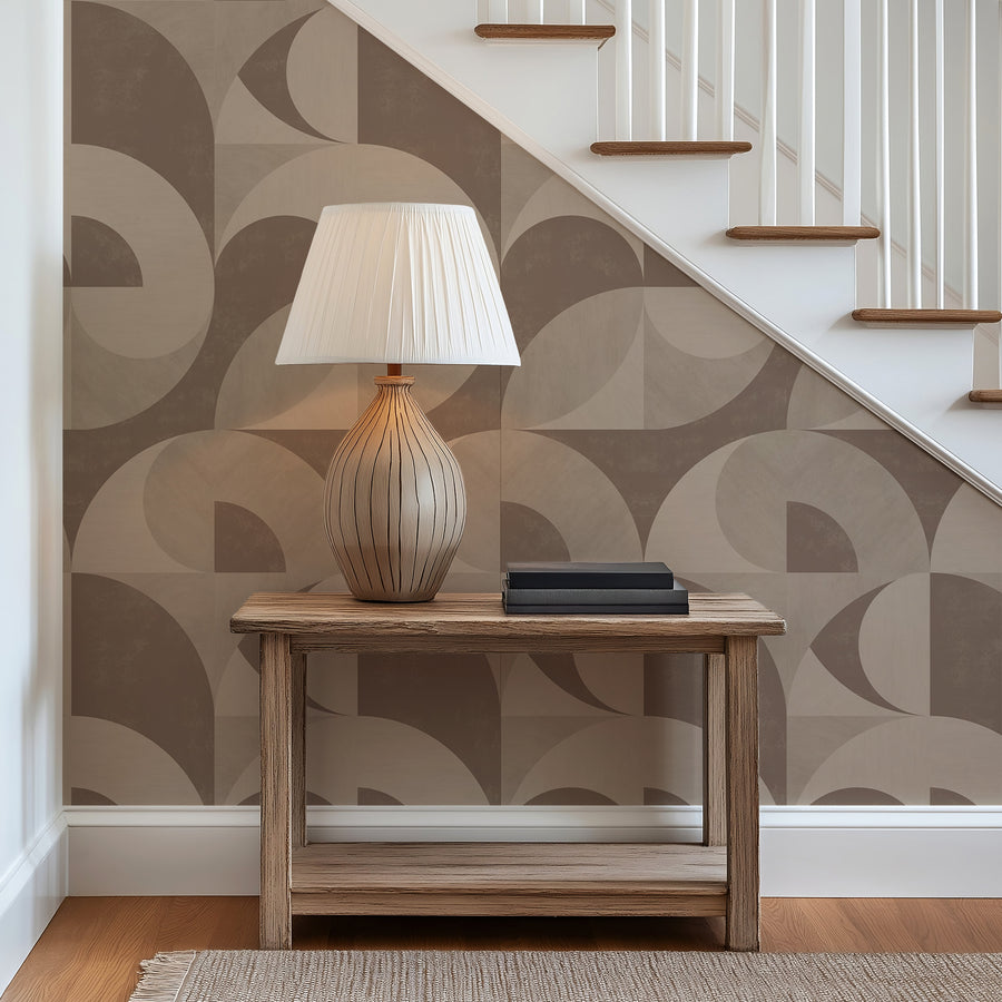 Staircase landing with console table and table lamp featuring Bauhaus Geometric Shapes Wallpaper Brown Tan accent wall