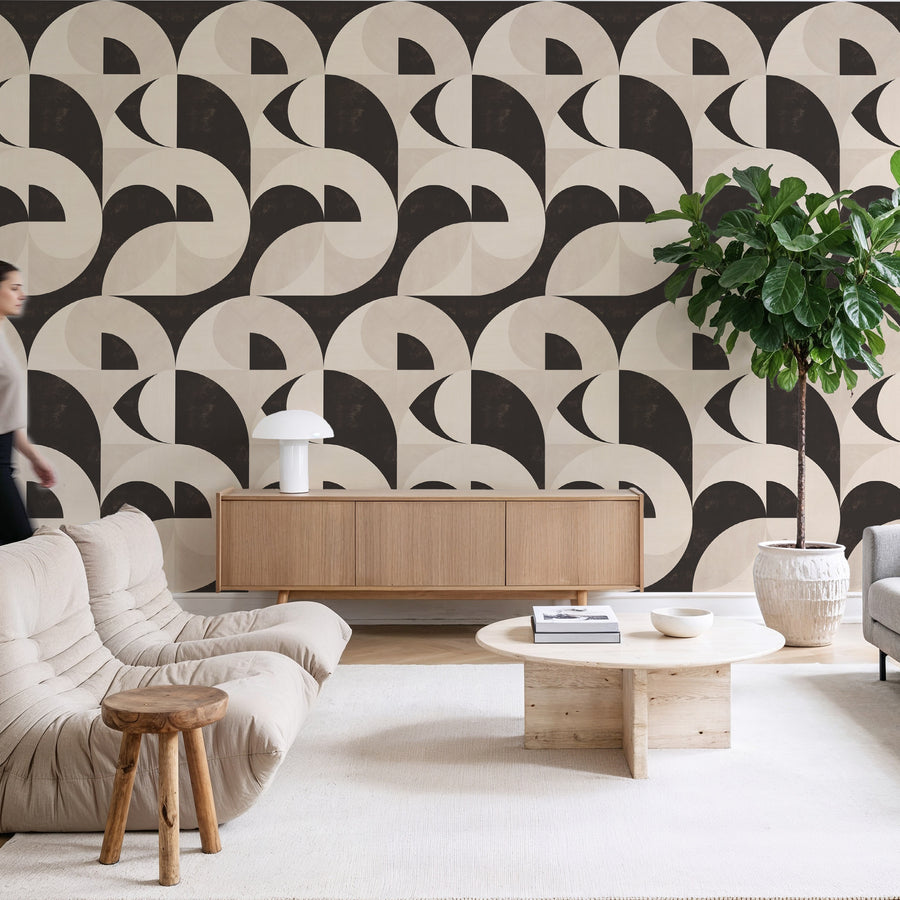 Living room with cream sofa wooden coffee table sideboard and potted plant featuring Bauhaus Geometric Shapes Wallpaper Espresso Cream by Petra Kohlmayr