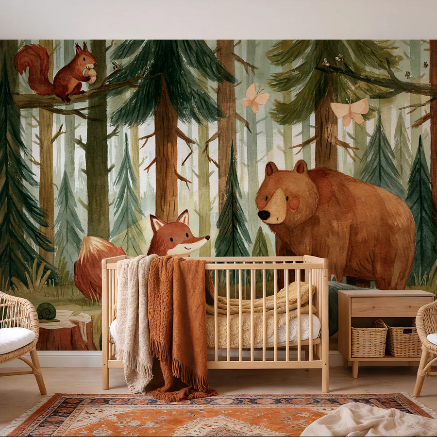 Watercolor bear and fox forest mural in a nursery with a wooden crib and patterned rug