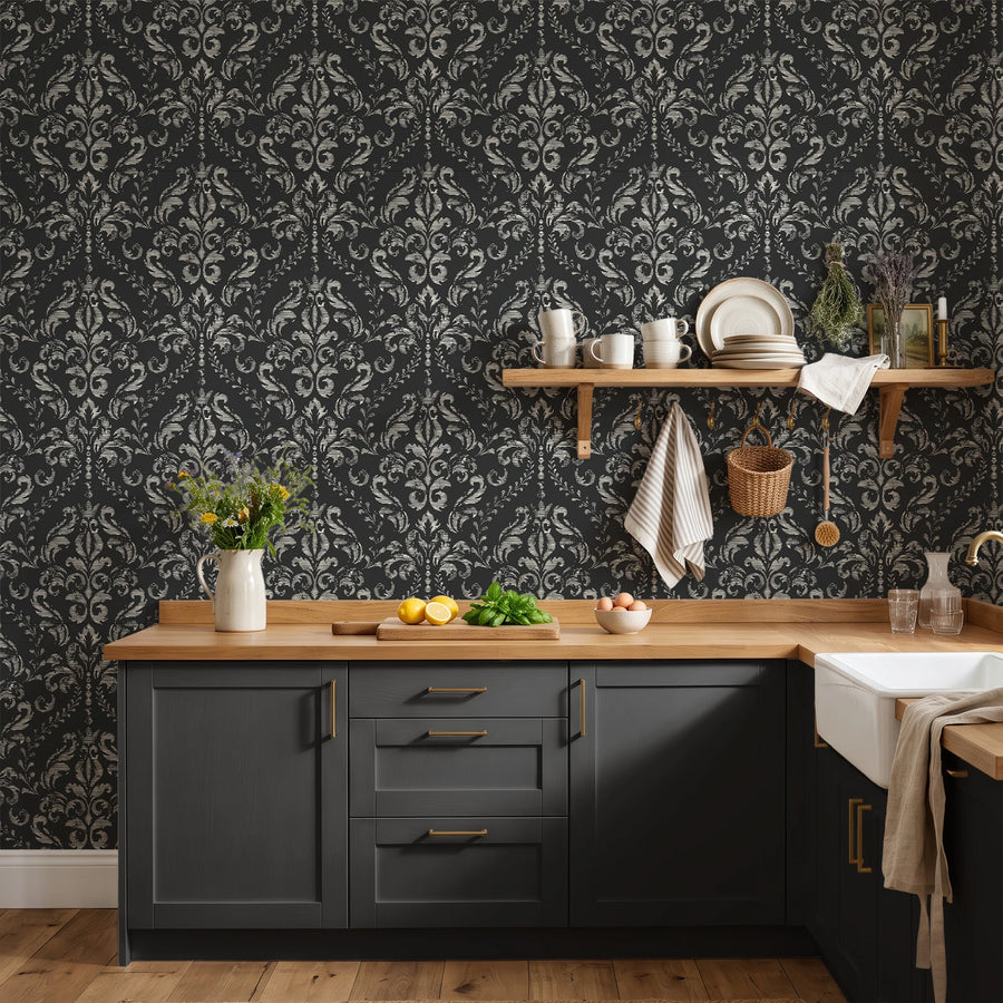 Black distressed damask wallpaper in a kitchen with dark cabinets