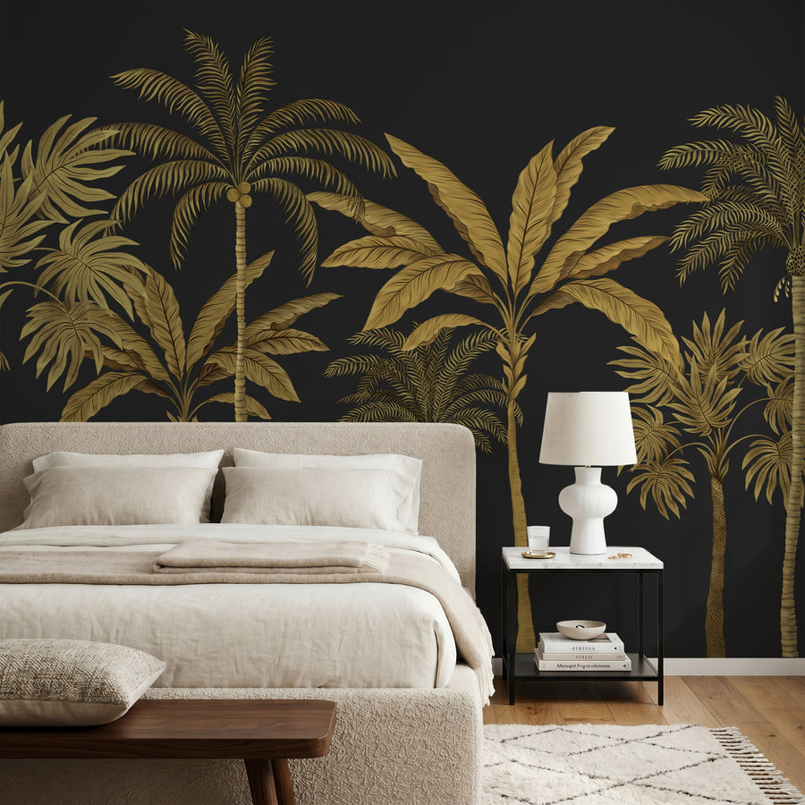 Black and gold palm tree mural in a bedroom behind a linen bed