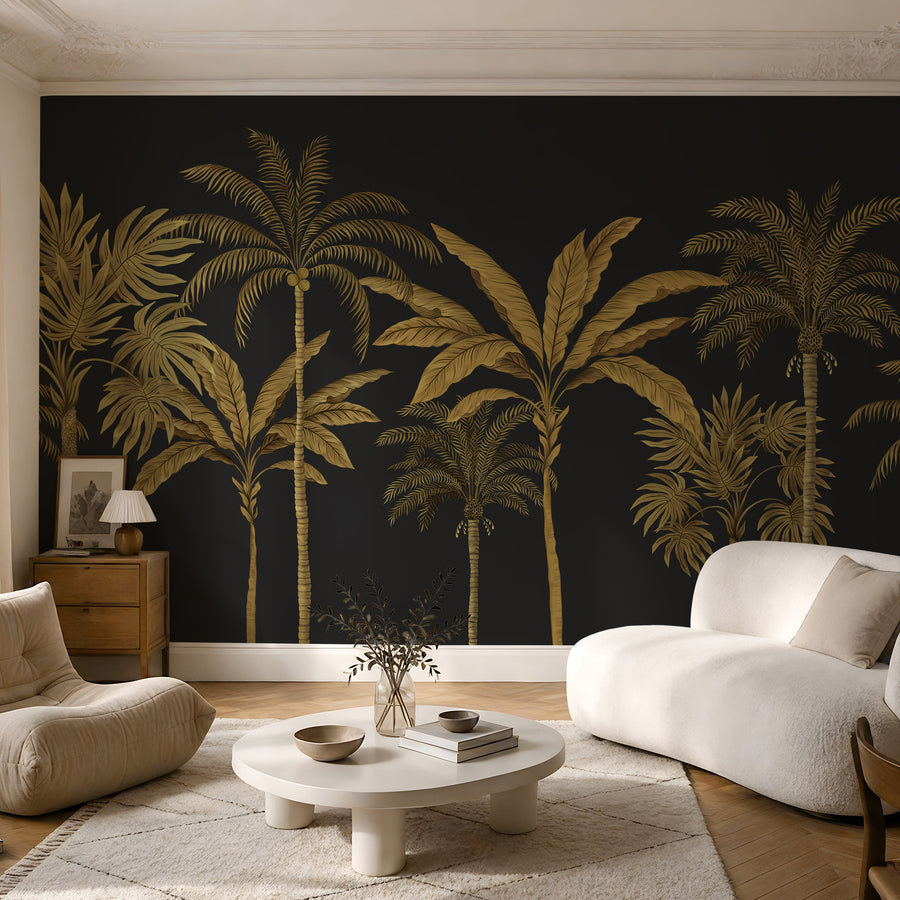 Black and gold palm tree tropical wallpaper mural in a living room with white boucle chairs
