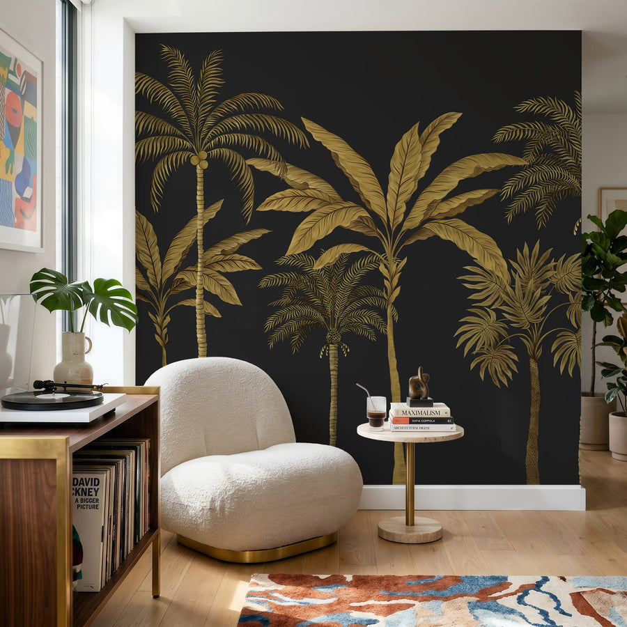 Black and gold palm tree mural in a sitting room behind a cream boucle armchair