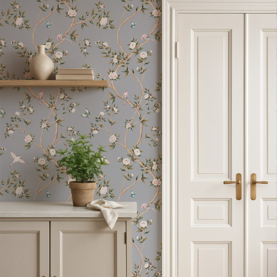 Console with wall shelf and potted plant beside white double doors featuring Blue Chinoiserie Hemma Wallpaper Floral Garden Birds