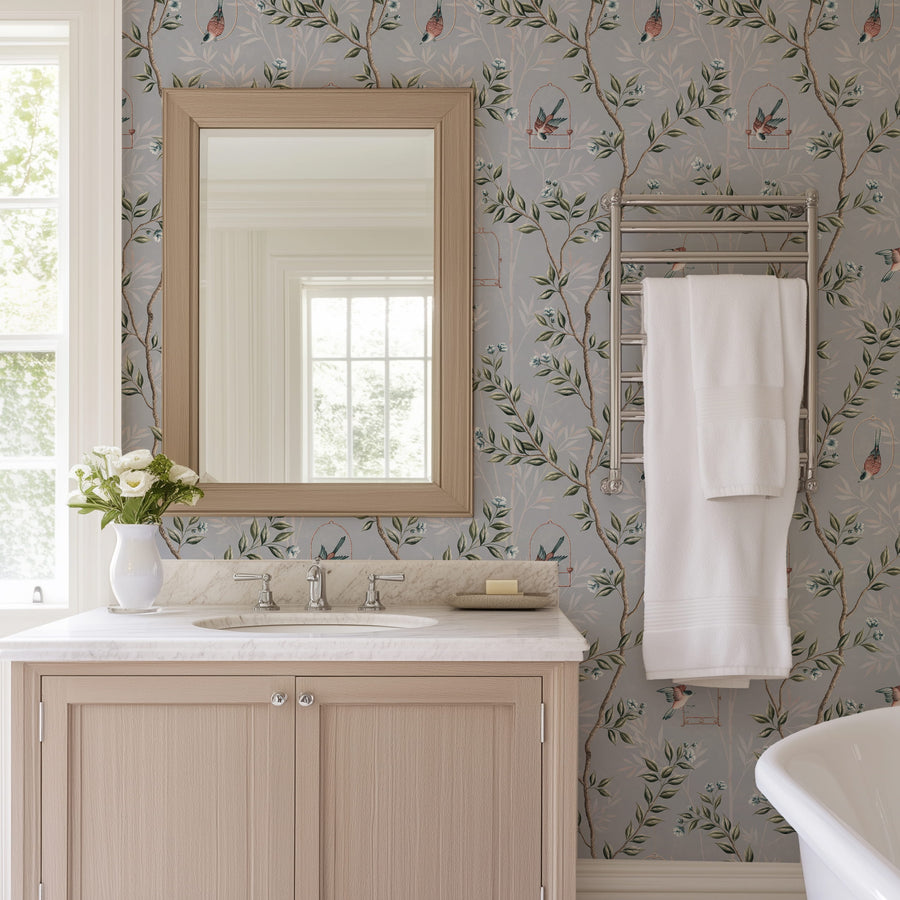Bathroom with framed mirror vanity and hanging towel featuring Blue Chinoiserie Pauline Wallpaper Birds Branches accent wall