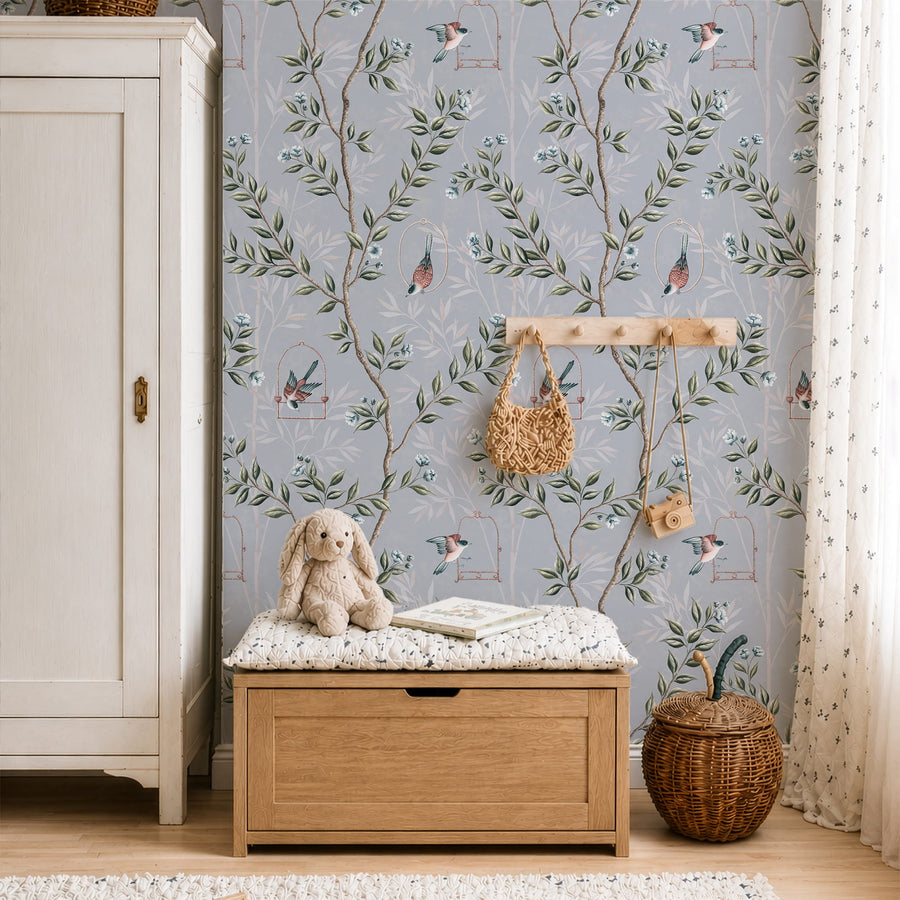 Entryway with wood storage bench wall hooks and basket featuring Blue Chinoiserie Pauline Wallpaper Birds Branches accent wall