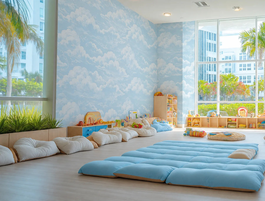 Blue sky and clouds wall mural in a bright children's playroom