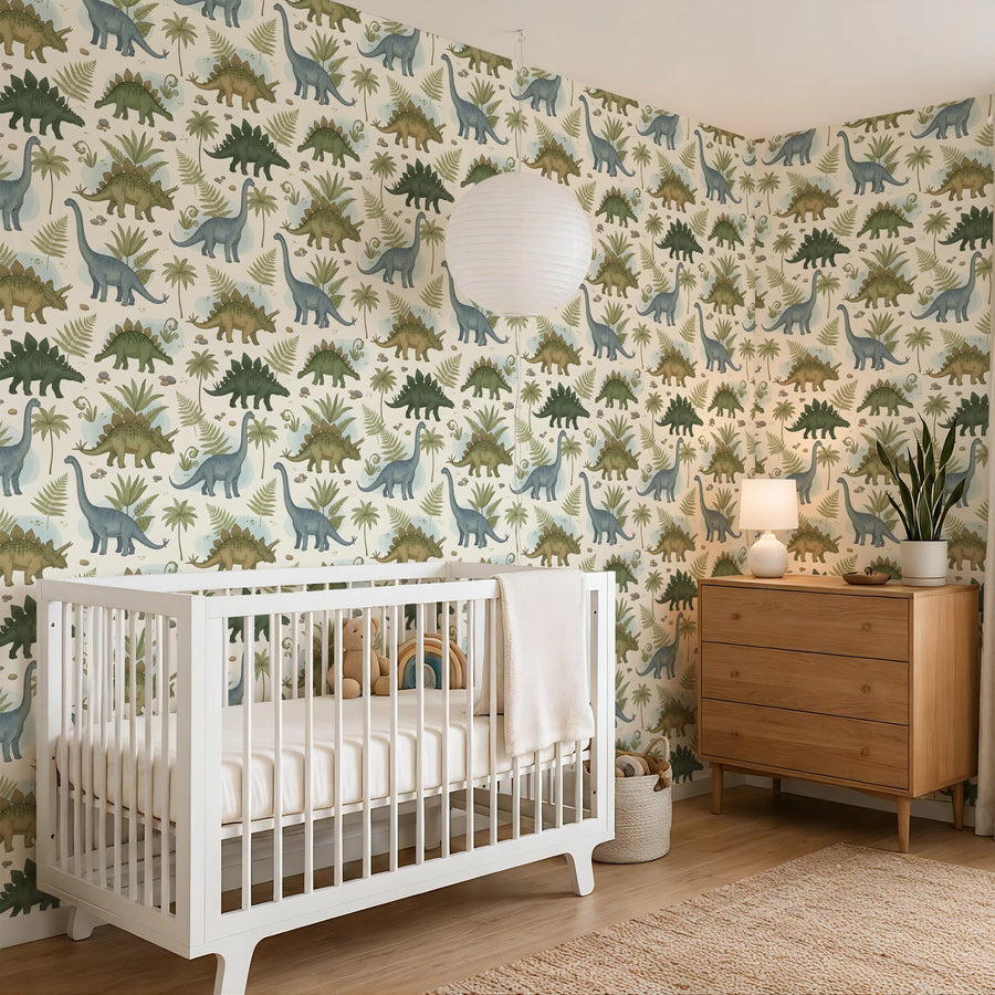 Sage and cream botanical dinosaur wallpaper wrapping a nursery corner with a white crib and paper lantern