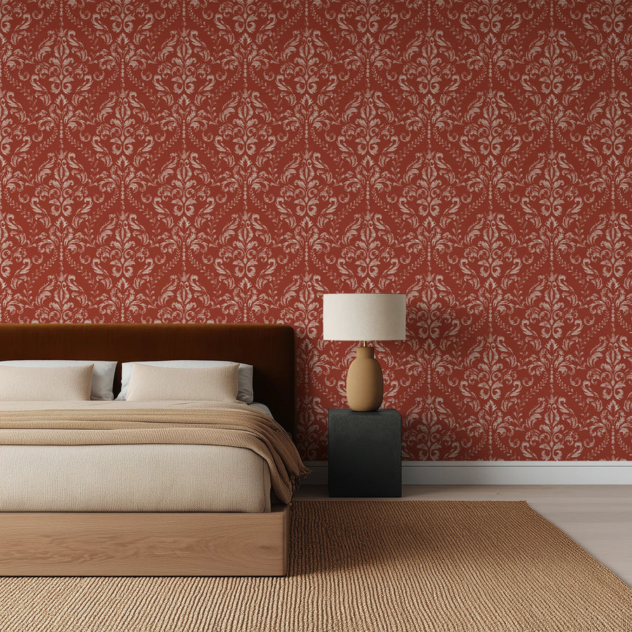 Classic red damask wallpaper in a bedroom with linen bedding