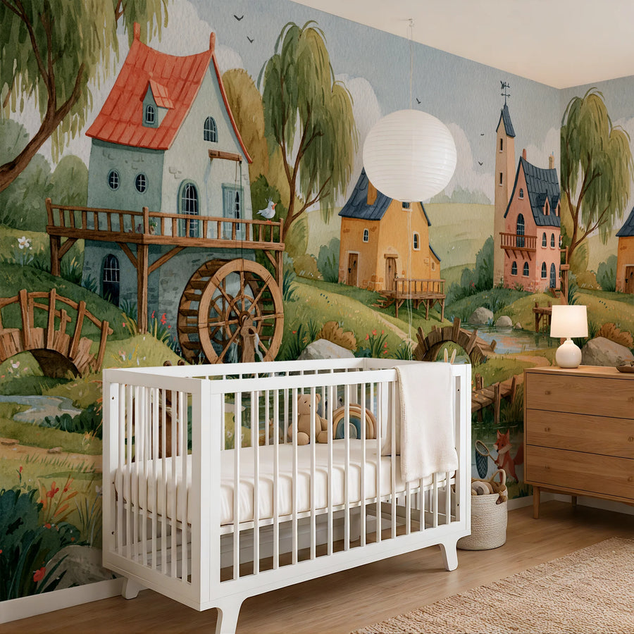 Countryside watermill nursery mural behind a white crib and wooden dresser