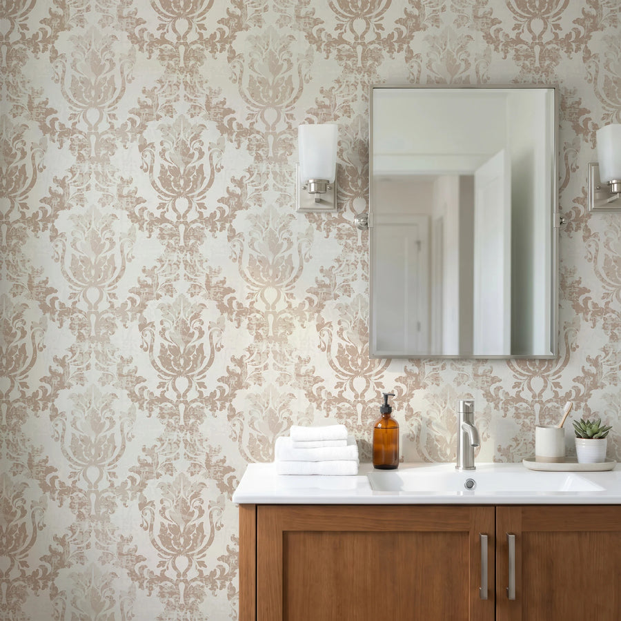 Cream beige and brown rococo damask wallpaper in a bathroom with a wood vanity and mirror
