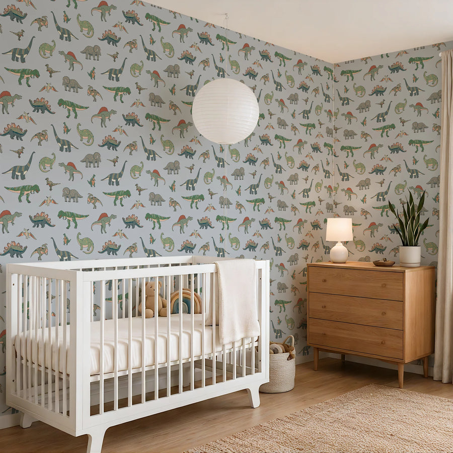 Baby blue cartoon dinosaur kids wallpaper wrapping a nursery corner with a white crib and paper lantern