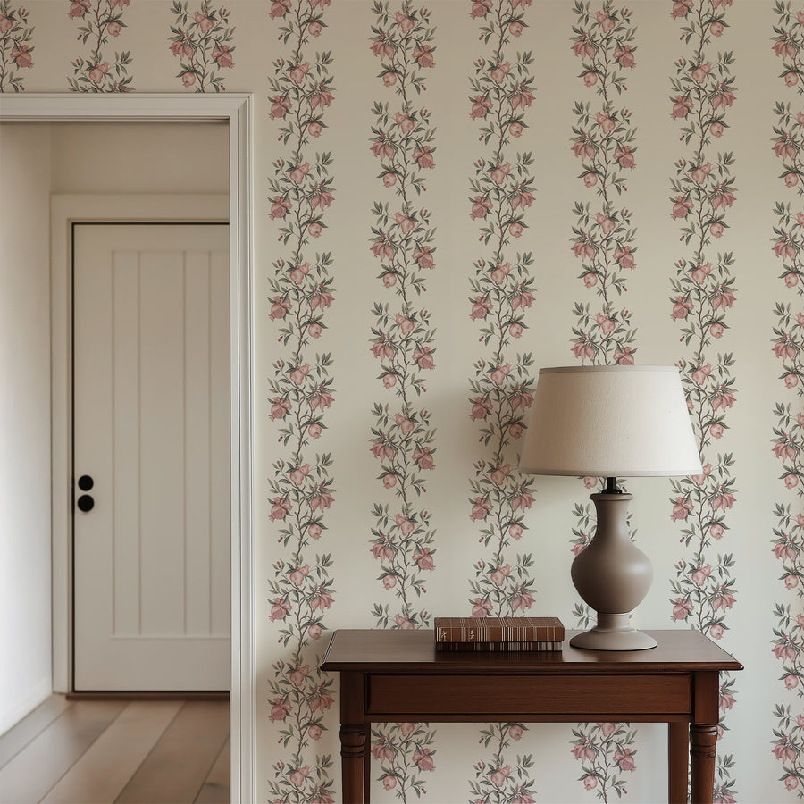 Entryway with wood console table lamp and white door featuring Elodie Chinoiserie Pomegranate Wallpaper Beige accent wall