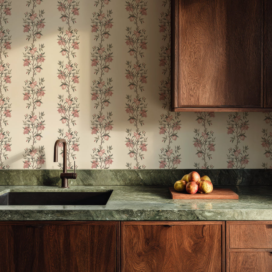 Kitchen with dark green counter wood cabinets and fruit bowl featuring Elodie Chinoiserie Pomegranate Wallpaper Beige accent wall