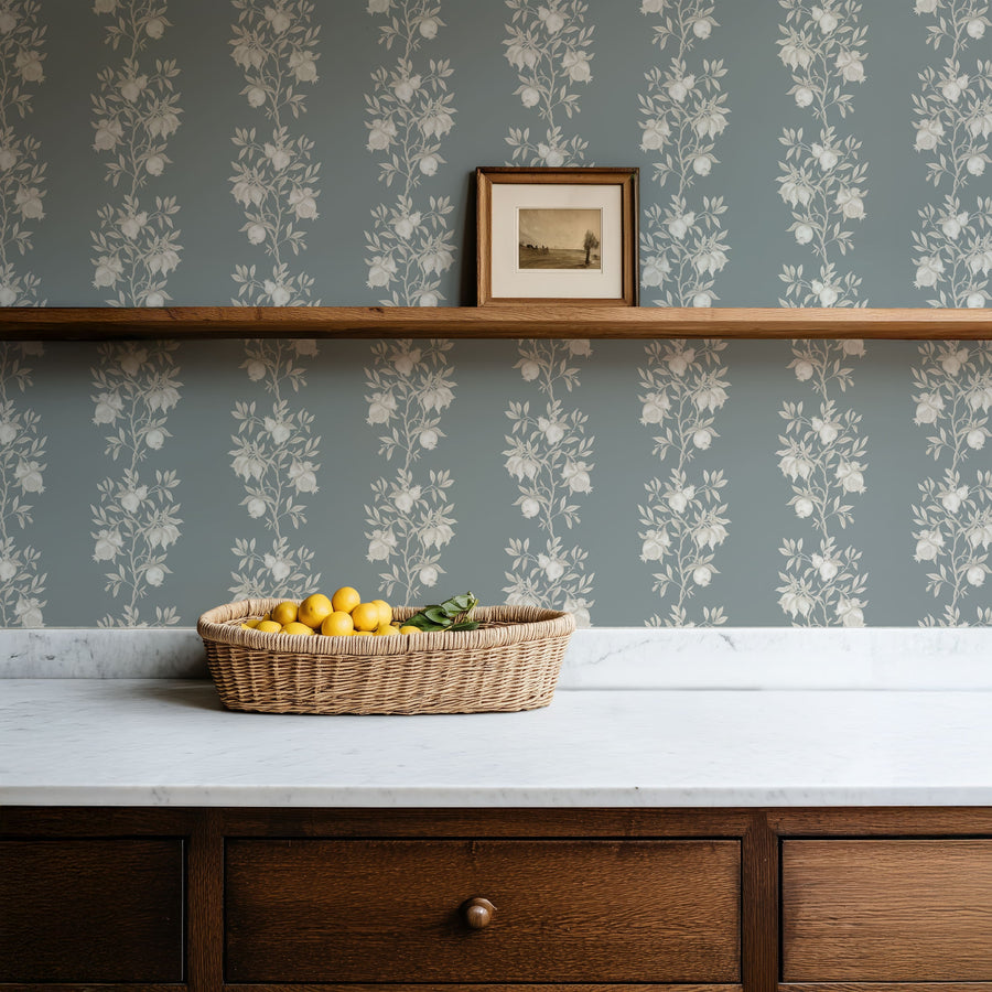 Console with wall shelf and fruit bowl featuring Elodie Chinoiserie Pomegranate Wallpaper Muted Blue accent wall