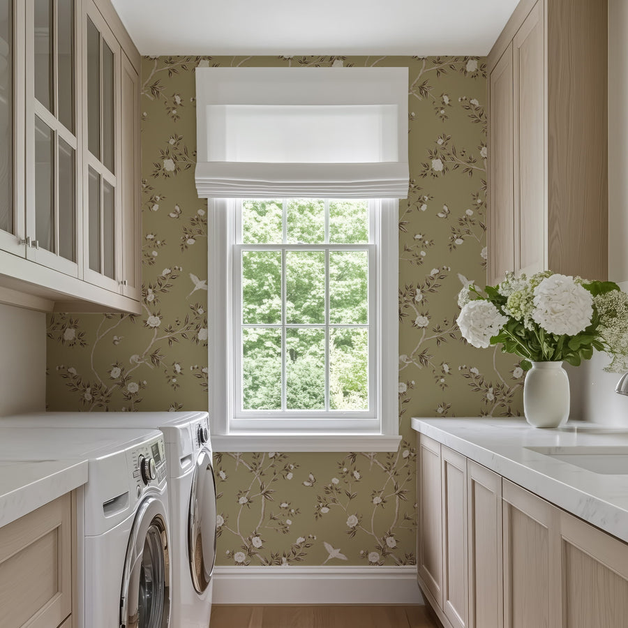 Laundry room with washer cabinets and window featuring Green Chinoiserie Hemma Wallpaper Floral Garden Birds accent wall