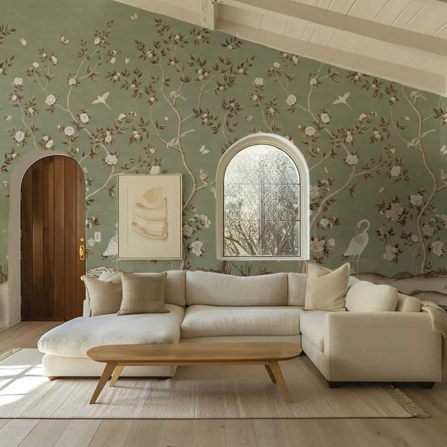 Living room with cream sofa wood coffee table and arched mirror featuring Green Chinoiserie Wallpaper Mural Birds Cranes accent wall