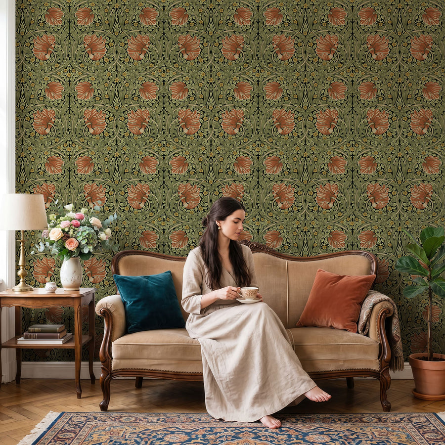 Green and terracotta William Morris Pimpernel wallpaper in a living room with an antique settee