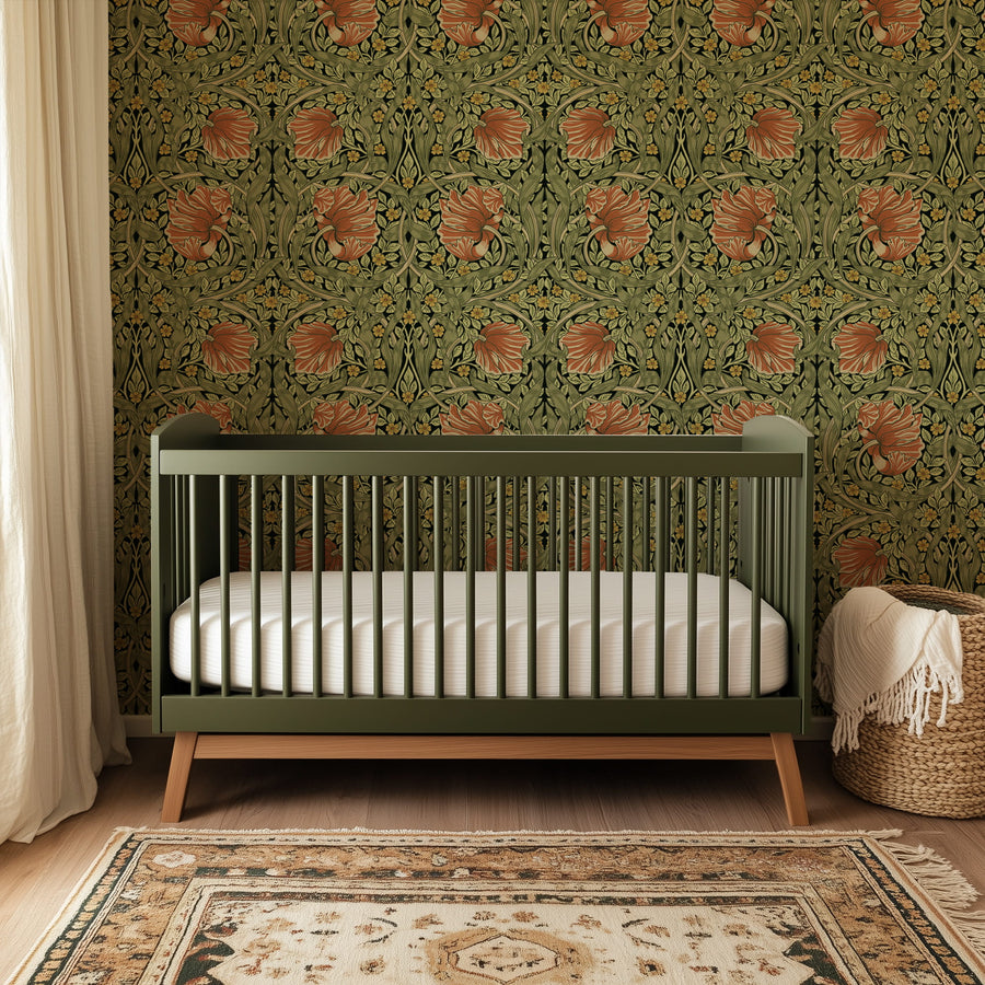Green and terracotta William Morris Pimpernel wallpaper in a nursery with crib