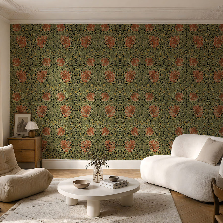 Green and terracotta William Morris Pimpernel wallpaper in a sitting room with a boucle sofa