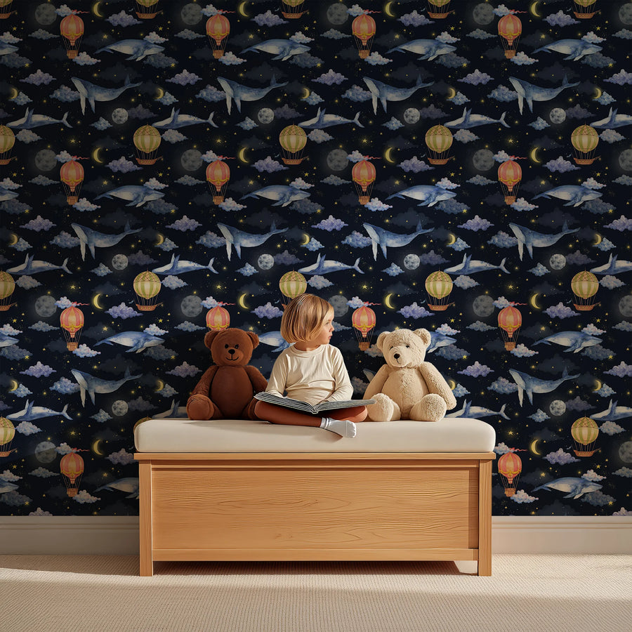 Night sky hot air balloon and whale wallpaper behind a wooden toy bench with teddy bears