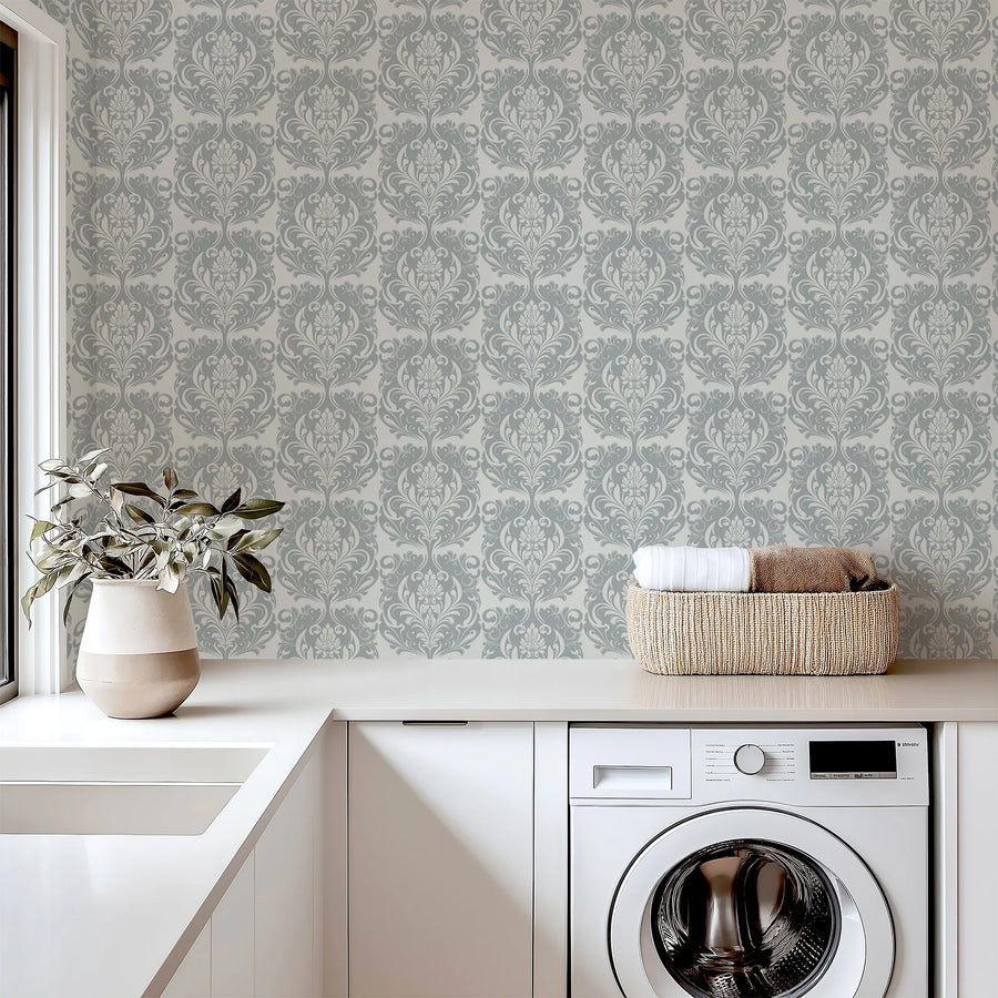 Imperial grey damask wallpaper in a bright laundry room with white counters