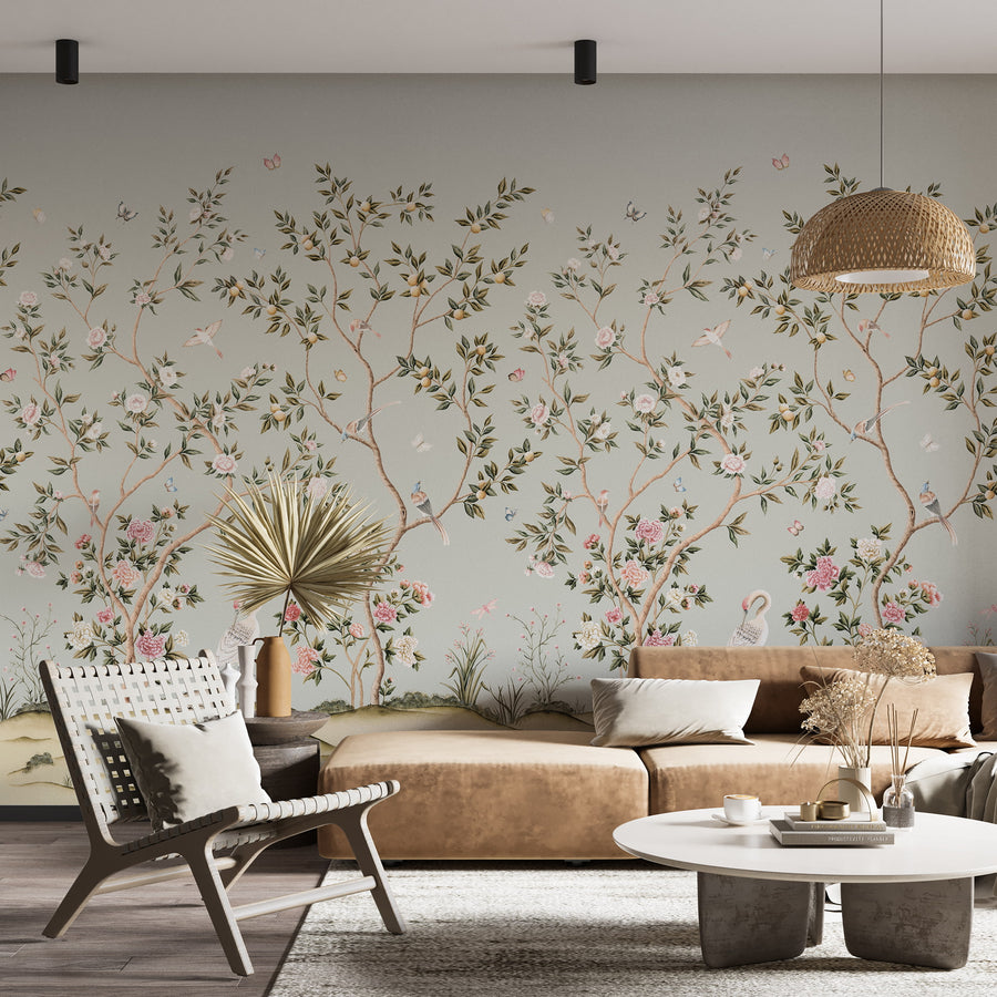 Light blue chinoiserie crane mural in a sitting room with armchairs and coffee table